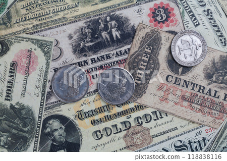 Old west US banknotes and silver certificates with silver dollar coins 118838116