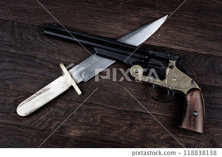 Old West Revolver with bowie knife on leather jacket 118838138