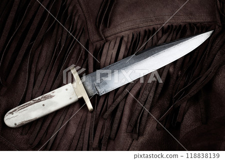 Old west bowie knife on leather jacket 118838139