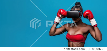 Young African-American woman wearing VR glasses and red boxing gloves against blue background. Online sport raining, virtual reality 118838639