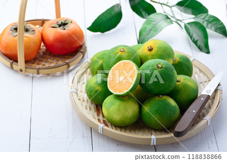 Tastes of Autumn: Early Mandarin Oranges and Persimmons Tastes of Autumn: Early Mandarin Oranges and Persimmons 118838866