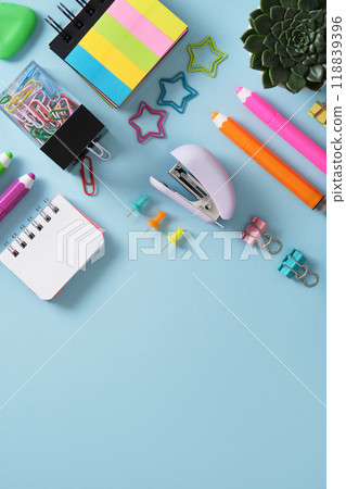 Stationery background with stapler, felt tip pens, paper clips, clipboards, paper clips, post-it notes and pins. Light blue backdrop. Space for your text. Stationery background with stapler, felt tip pens, paper clips, clipboards, paper clips, post-it notes and pins. Light blue backdrop. Space for your text. 118839396