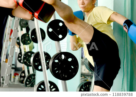 Men hitting kicks and trainers with mitts Men hitting kicks and trainers with mitts 118839788