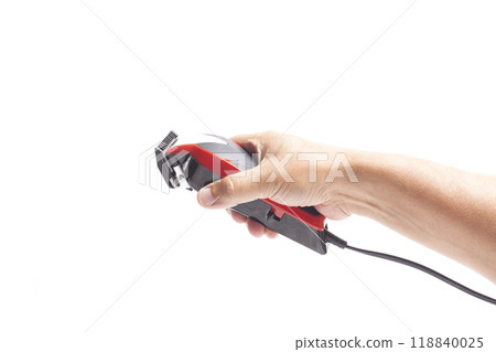 Hair clipper in a man's hand Hair clipper in a man's hand 118840025