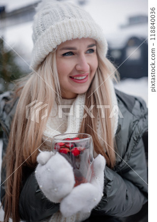 Cozy winter day with warm drink and baked goods in snowy outdoor setting Cozy winter day with warm drink and baked goods in snowy outdoor setting 118840036