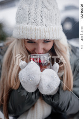 Cozy winter day with warm drink and baked goods in snowy outdoor setting Cozy winter day with warm drink and baked goods in snowy outdoor setting 118840056