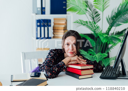 woman working at desk in office online learning 118840210