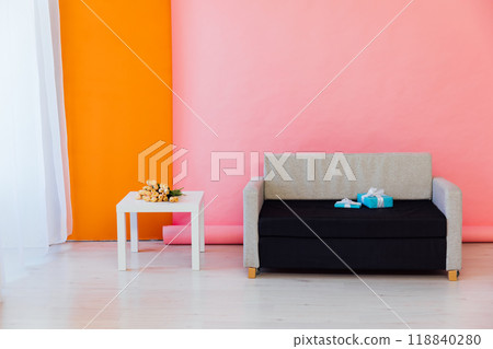 Gray office sofa with table in the interior of a pink orange room Gray office sofa with table in the interior of a pink orange room 118840280