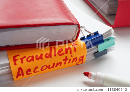 Stack of papers with a sticky note saying fraudulent accounting. Financial misconduct and business deception. Stack of papers with a sticky note saying fraudulent accounting. Financial misconduct and business deception. 118840340