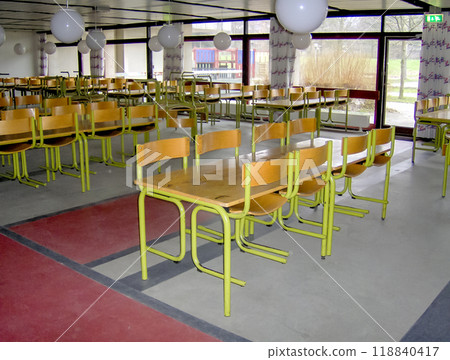 Empty classroom with desks and chairs at school. 118840417