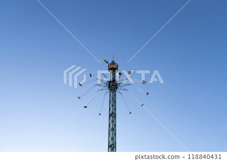 Amusement park. Spinning carousel at Tivoli Gardens. 118840431