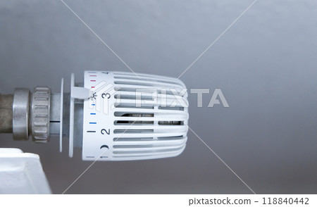 Heating battery temperature regulation in house with thermostat on white radiator. Heating battery temperature regulation in house with thermostat on white radiator. 118840442
