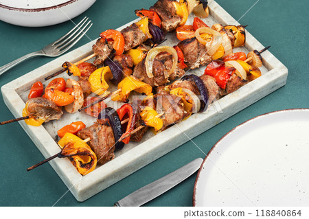 Delicious meat kebabs on skewers. 118840864