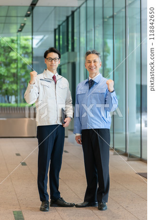 Man in work clothes portrait, fist pump 118842650