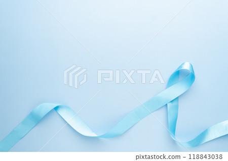 Men's health and Prostate cancer awareness campaign in November. Light blue ribbon awareness on sky blue background. Symbol for support men who living with cancer. Copy space. 118843038