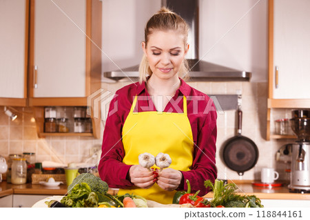 Woman holding two garlic Woman holding two garlic 118844161