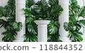 White columns in a building facade with green areca palms around 118844352