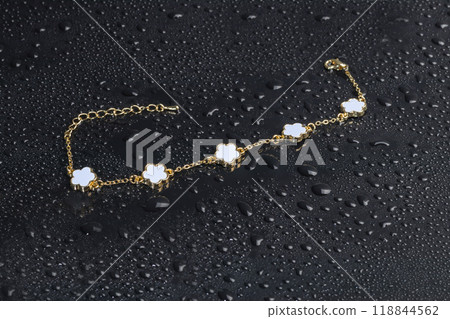Bracelets. Women's jewelry on a dark background. Metal products. Fashion. Bracelets. Women's jewelry on a dark background. Metal products. Fashion. 118844562