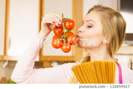 Woman holding pasta and tomatoes Woman holding pasta and tomatoes 118844927