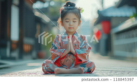 A Young Girl's Moment of Tranquility in a Japanese Street 118845397