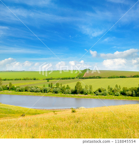 Agricultural fields, meadows, lake and sky. Agricultural fields, meadows, lake and sky. 118845554