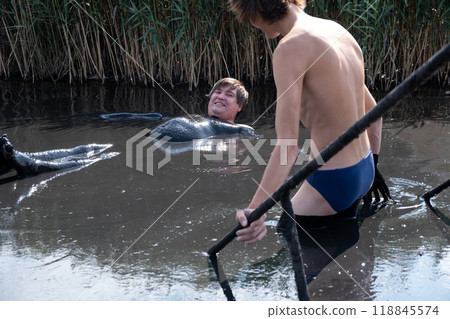 young men in the healing mud. mineral salt lakes with useful mud young men in the healing mud. mineral salt lakes with useful mud 118845574