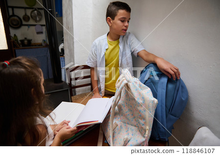 Children preparing for school with backpacks and notebooks 118846107