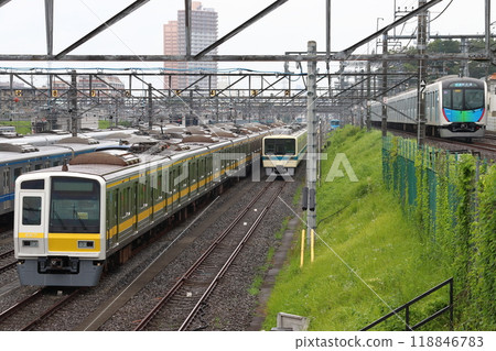 Odakyu 8000 series train parked at Kotesashi Depot and a passing 40050 series train 118846783
