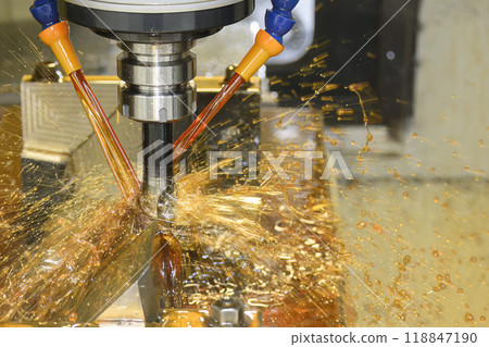 Close up scene the CNC milling machine cutting the mold parts with oil coolant method. Close up scene the CNC milling machine cutting the mold parts with oil coolant method. 118847190