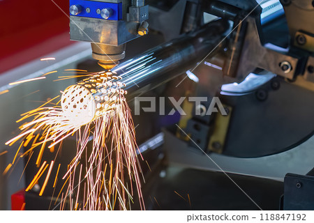 Close up scene the fiber laser cutting machine cut the stainless steel tube and sparkling light. Close up scene the fiber laser cutting machine cut the stainless steel tube and sparkling light. 118847192