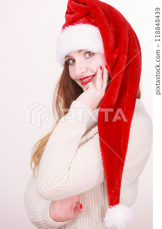 Woman wearing santa claus hat Woman wearing santa claus hat 118848439