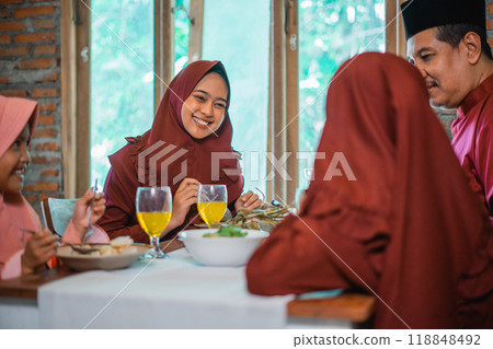 Enjoy a Cultural Family Gathering with a Traditional Meal full of Laughter and Joy 118848492