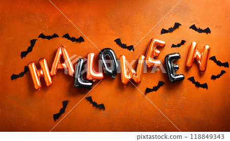 Halloween Balloon Letters and Flying Bats on Orange Background for Festive Decor 118849343