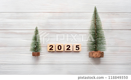 Miniature Christmas Trees and Wooden 2025 Blocks for New Year and Holiday Celebration 118849350