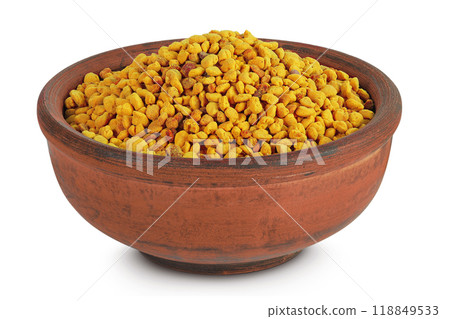 Bee pollen grains in ceramic bowl isolated on white background Bee pollen grains in ceramic bowl isolated on white background 118849533