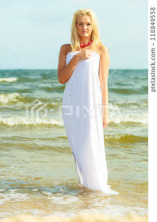 Attractive blonde woman on the beach. Attractive blonde woman on the beach. 118849558