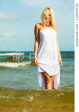 Young woman chilling out on the beach. Young woman chilling out on the beach. 118849559
