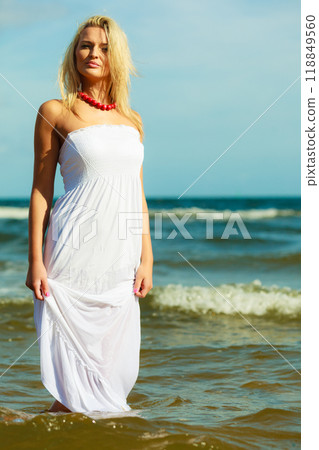 Young woman chilling out on the beach. Young woman chilling out on the beach. 118849560
