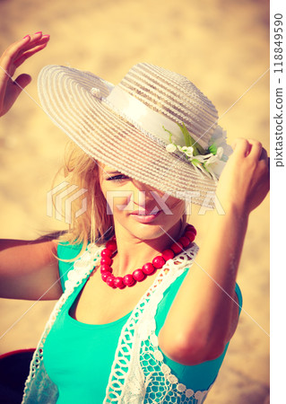 Portrait of beautiful woman during summer 118849590