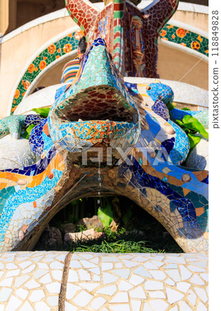 Multicolored mosaic dragon salamander of Gaudi in Park Guell, Barcelona, Spain 118849828