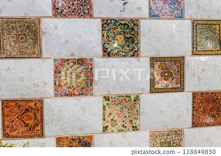 Mosaic wall by Antoni Gaudi in the Park Guell in Barcelona, Catalonia, Spain 118849830