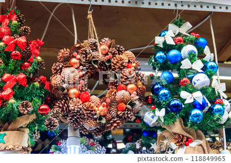Hanging Christmas wreaths for sale at Christmas market 118849965