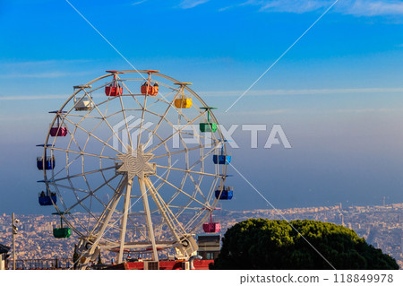 Ferris wheel in Tibidabo mount with panoramic view over Barcelona, Catalonia, Spain Ferris wheel in Tibidabo mount with panoramic view over Barcelona, Catalonia, Spain 118849978