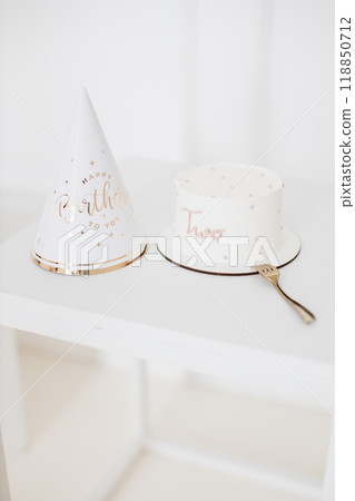 Birthday celebration with cake and party hat for second birthday Birthday celebration with cake and party hat for second birthday 118850712