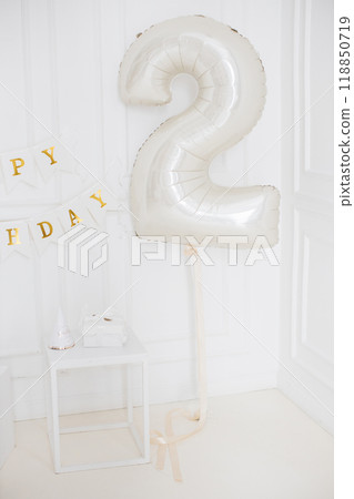 Elegant birthday decoration with number two balloon Elegant birthday decoration with number two balloon 118850719