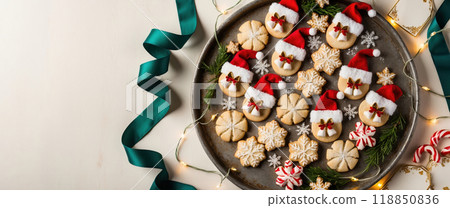 Christmas concept banner with festive cookies wearing santa hats on rustic background 118850836
