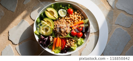 Healthy vegan lunch bowl with avocado and chickpeas on stone background 118850842