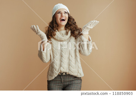 smiling elegant 40 years old woman catching snow 118850903