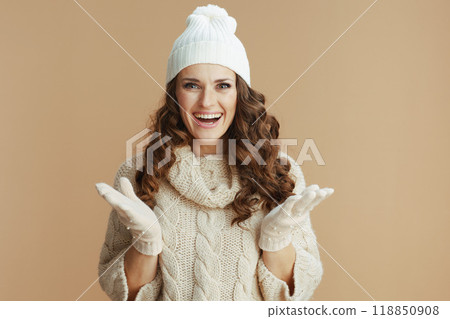 smiling trendy female against beige background 118850908