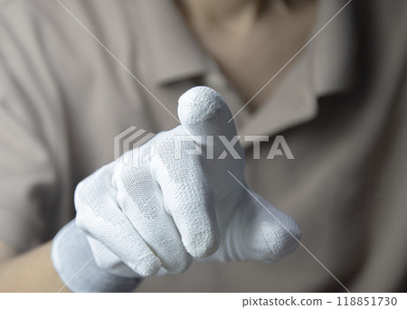 Man wearing white gloves, pointing finger Man wearing white gloves, pointing finger 118851730